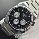 ساعت مردانه تیسوت صفحه مشکی سه موتوره(کورنوگراف) پی ار ایکس تمام استیل TISSOT 1853 PRX